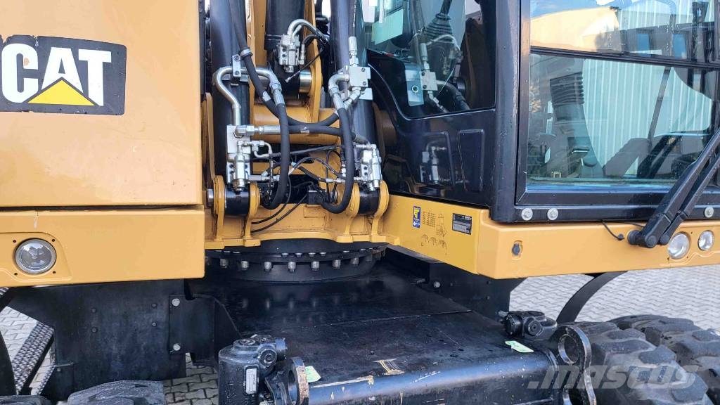 CAT M 318 F حفارات بعجل