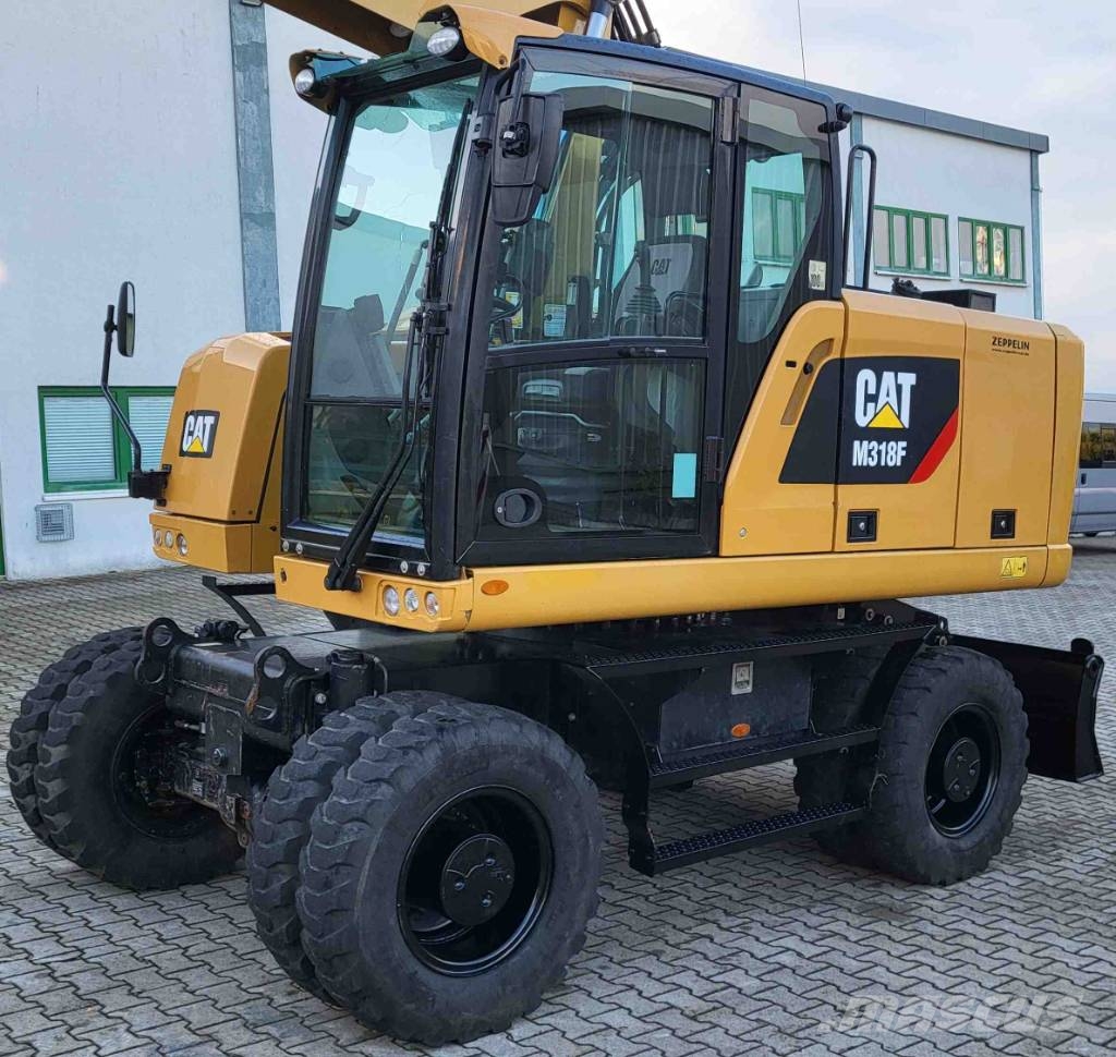 CAT M 318 F حفارات بعجل
