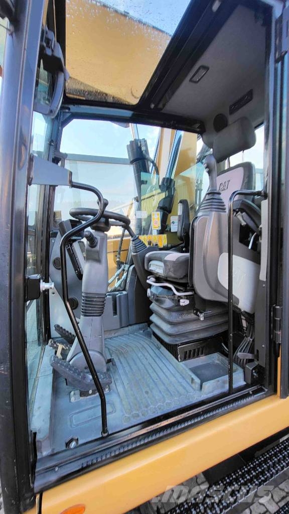 CAT M 318 F حفارات بعجل