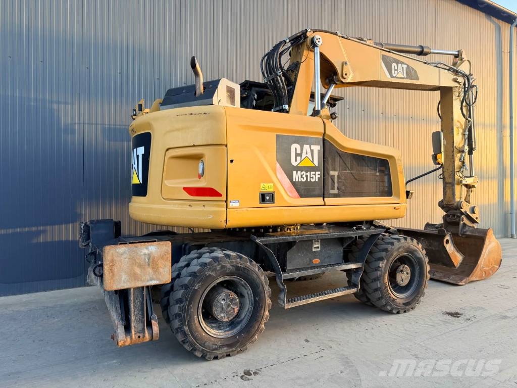 CAT M315F Pelle sur pneus