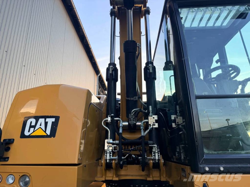 CAT M315F Pelle sur pneus