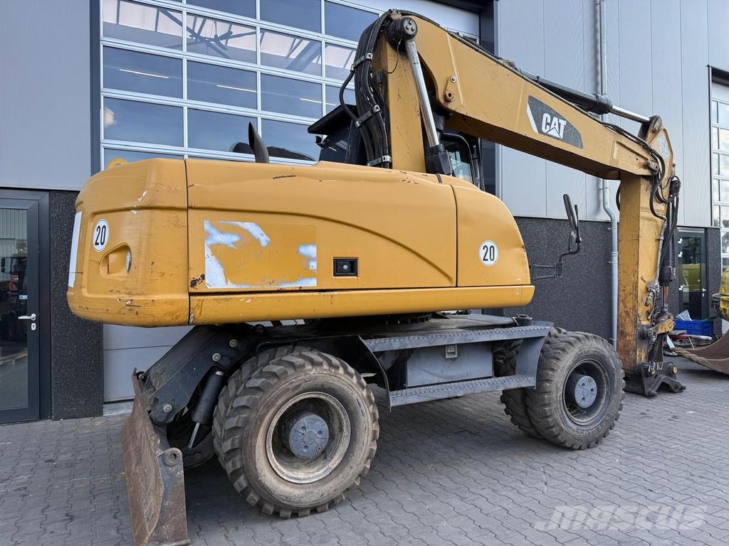 CAT M318D | A/C | German Machine! Bagri na kolesih