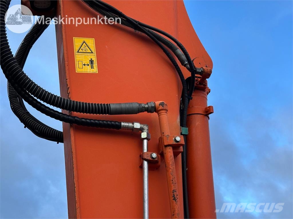 Hitachi ZX135US-5B Bandgrävare