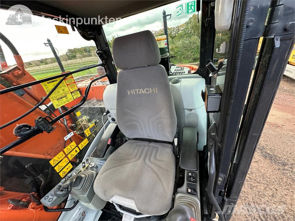 Hitachi ZX135US-5B Bandgrävare