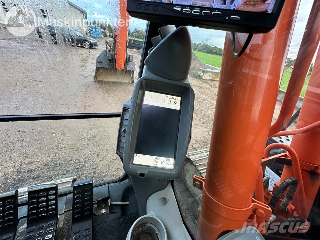 Hitachi ZX135US-5B Bandgrävare