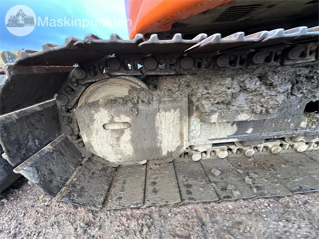 Hitachi ZX135US-5B Bandgrävare
