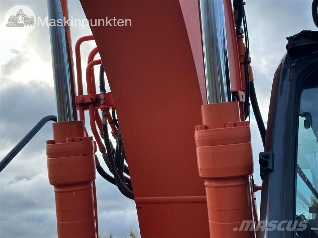 Hitachi ZX135US-5B Bandgrävare