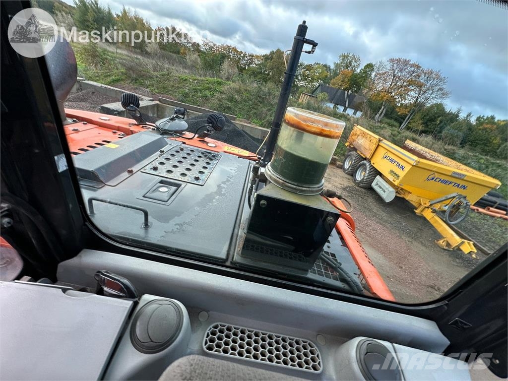 Hitachi ZX135US-5B Bandgrävare