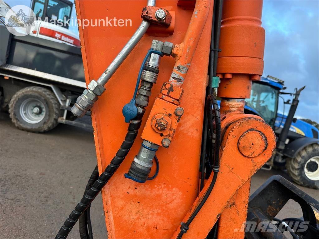 Hitachi ZX135US-5B Bandgrävare