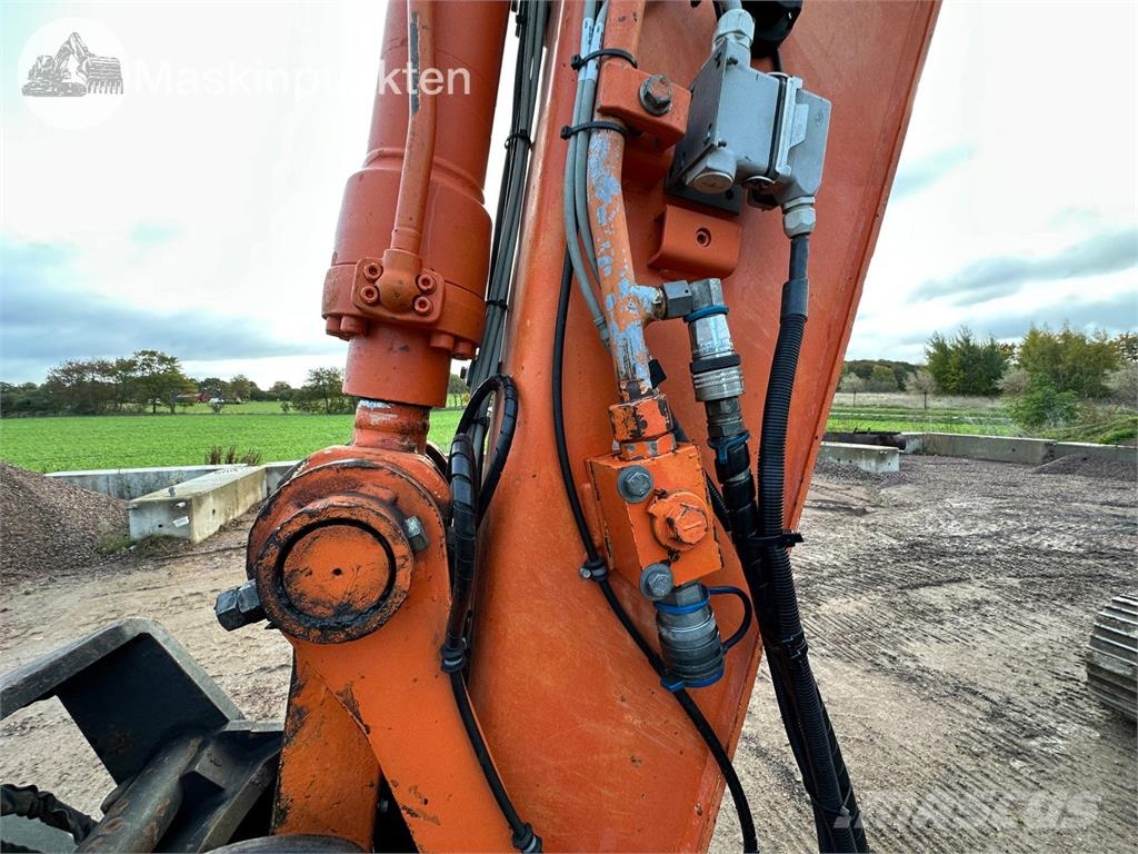 Hitachi ZX135US-5B Bandgrävare