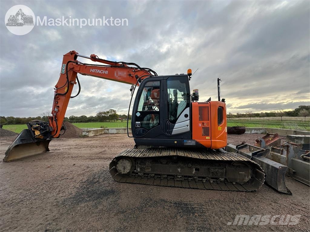 Hitachi ZX135US-5B Bandgrävare