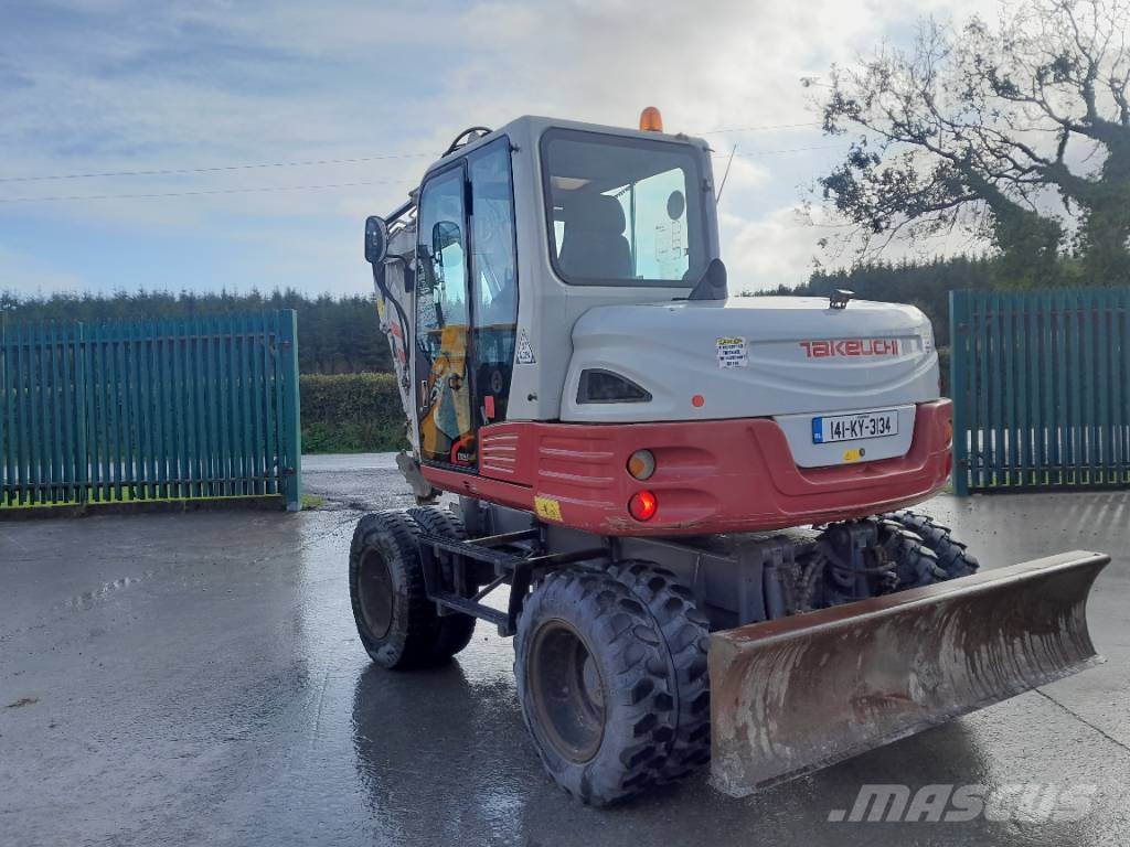 Takeuchi TB 295 حفارات بعجل