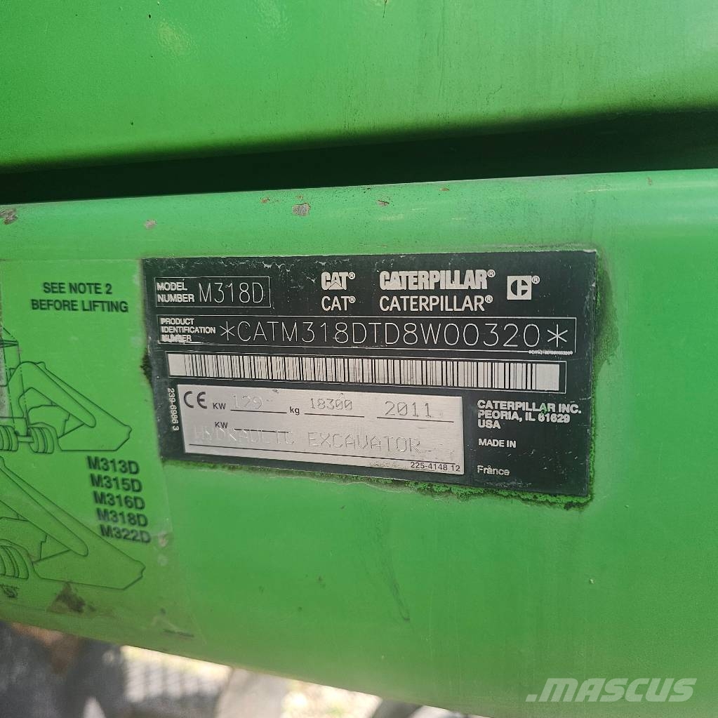 CAT 318 D حفارات بعجل