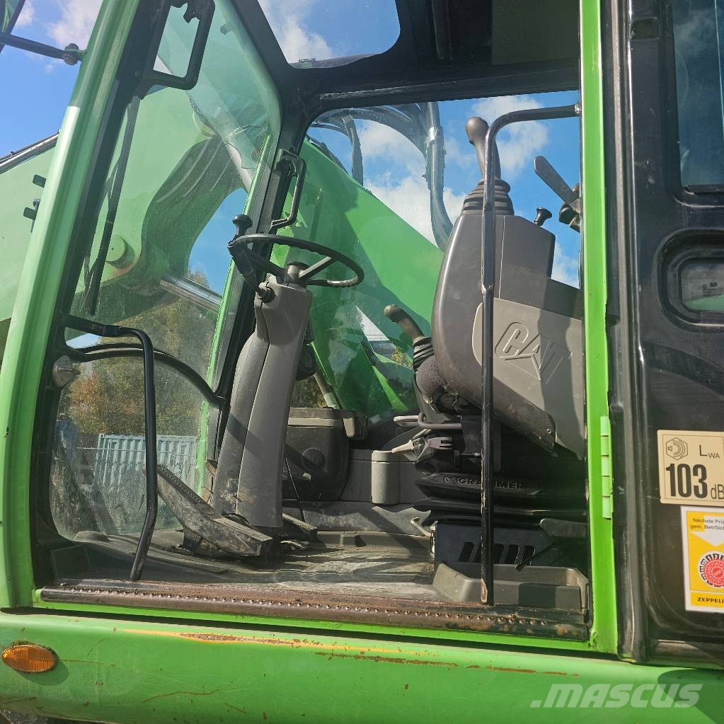 CAT 318 D حفارات بعجل
