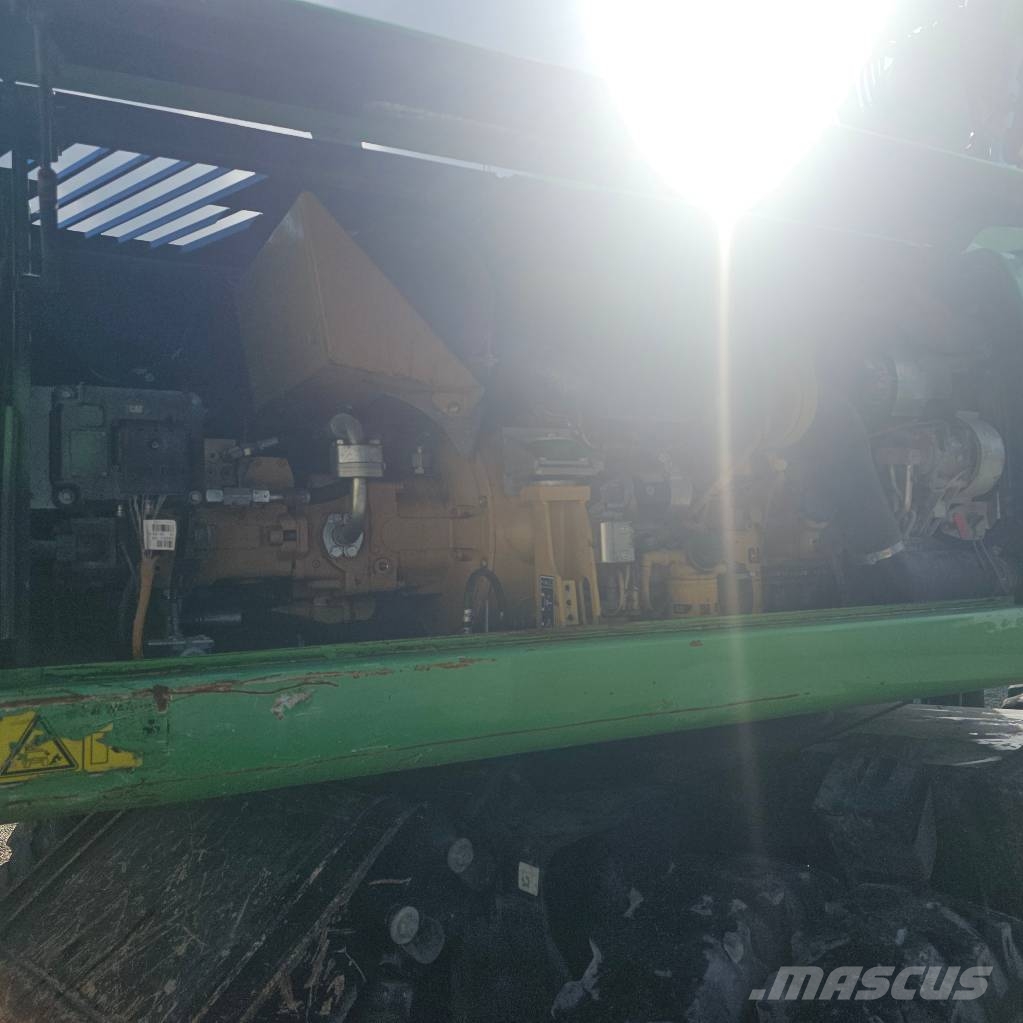 CAT 318 D حفارات بعجل