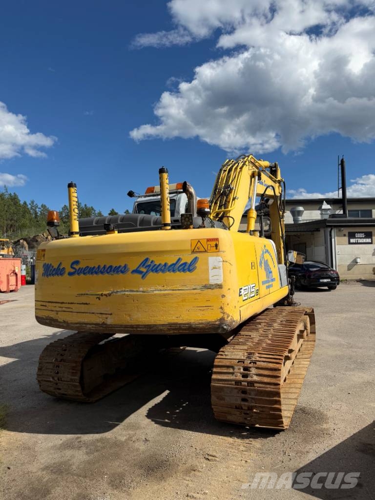 New Holland E 215 B حفارات زحافة