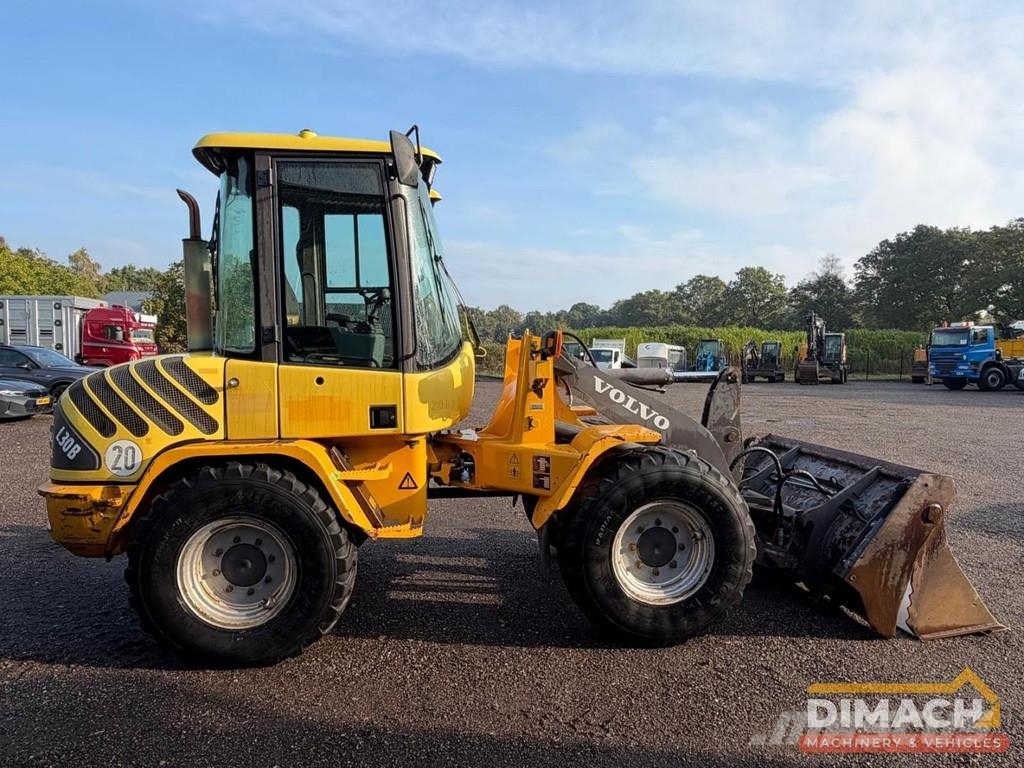Volvo L30B Quick coupler - Folding bucket - Forks Wheel loaders
