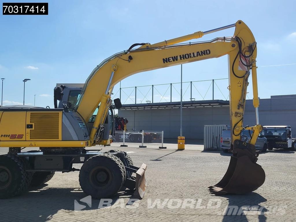 New Holland MH 5.6 Outriggers + Blade Kolesové rýpadlá