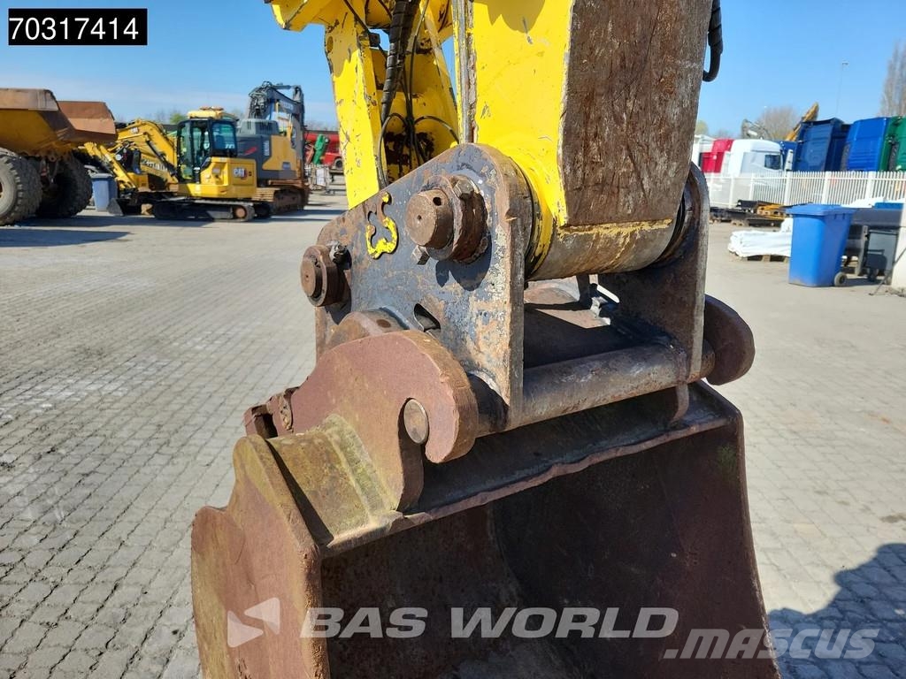 New Holland MH 5.6 Outriggers + Blade Kolesové rýpadlá