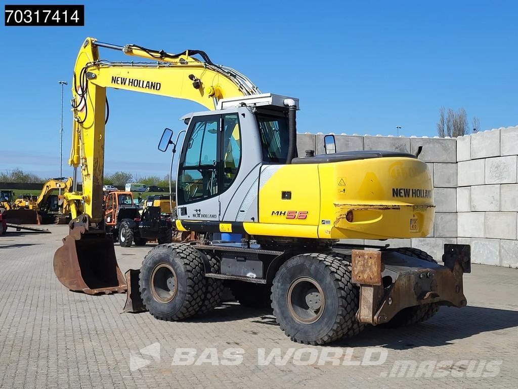New Holland MH 5.6 Outriggers + Blade Kolesové rýpadlá
