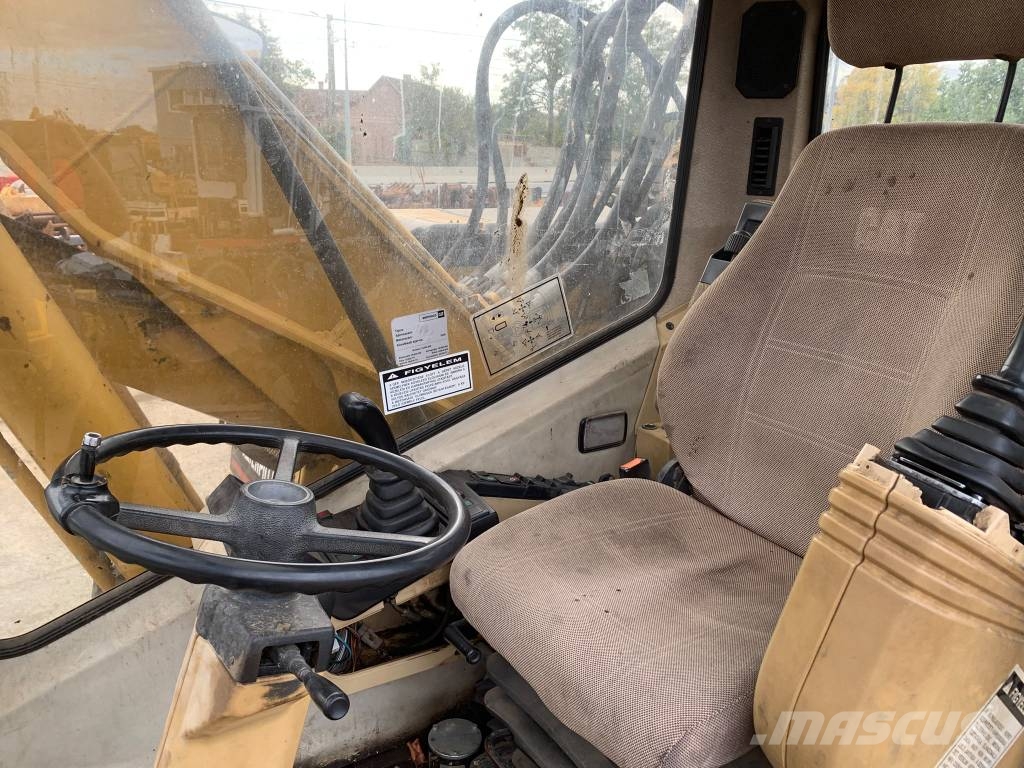 CAT M 318 حفارات بعجل