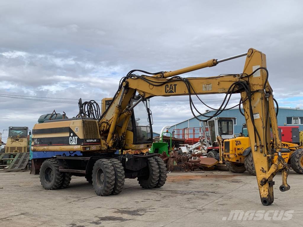 CAT M 318 حفارات بعجل