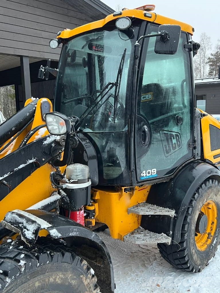 JCB 409 لوادر بعجل