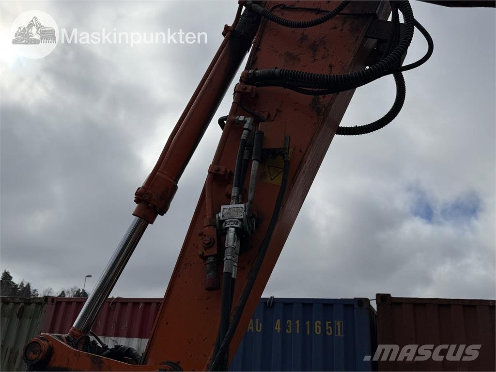 Hitachi ZX 140W-5B حفارات بعجل