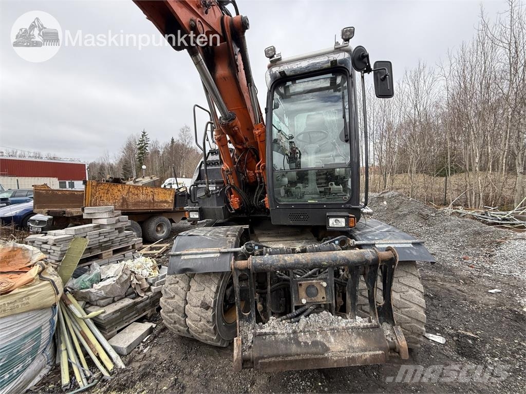 Hitachi ZX 140W-5B حفارات بعجل