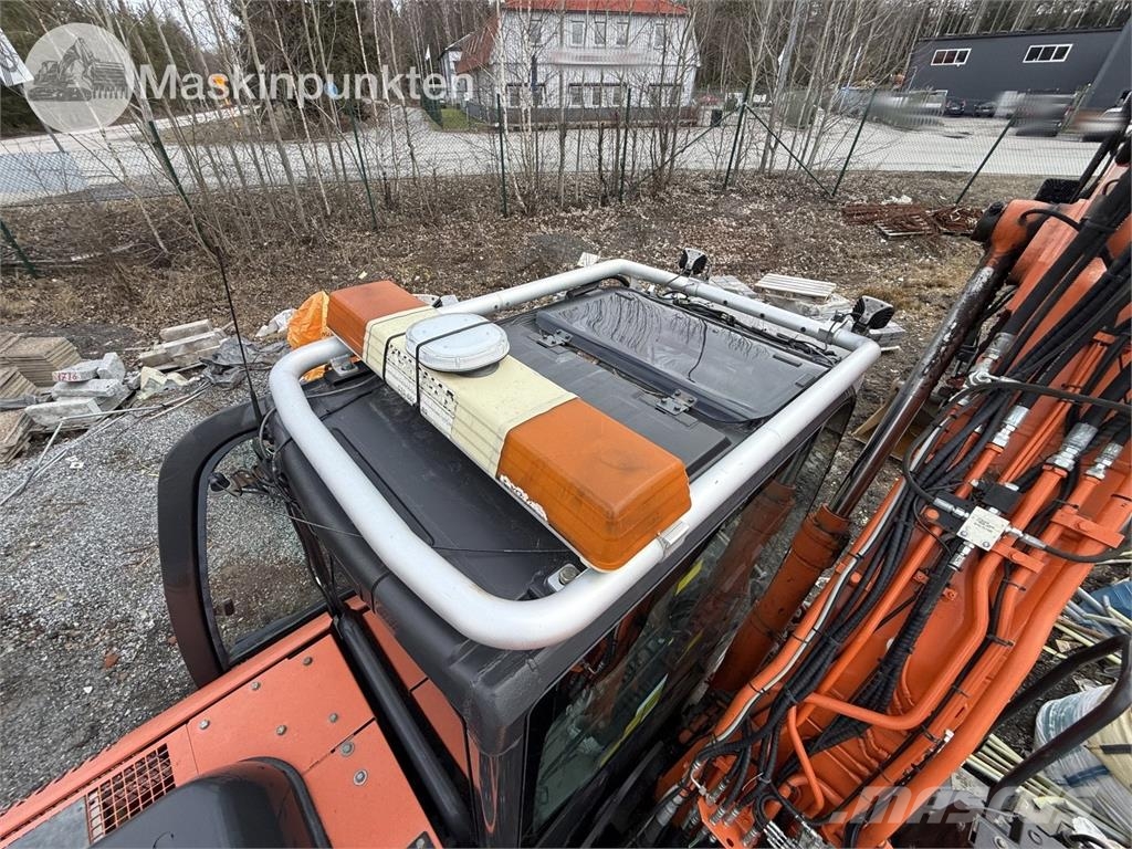 Hitachi ZX 140W-5B حفارات بعجل