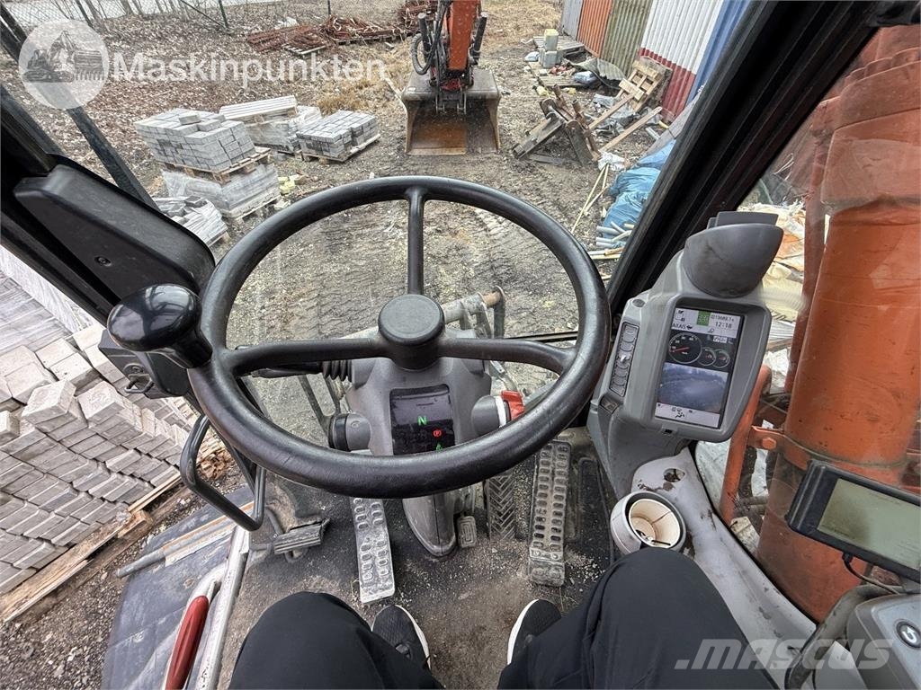 Hitachi ZX 140W-5B حفارات بعجل