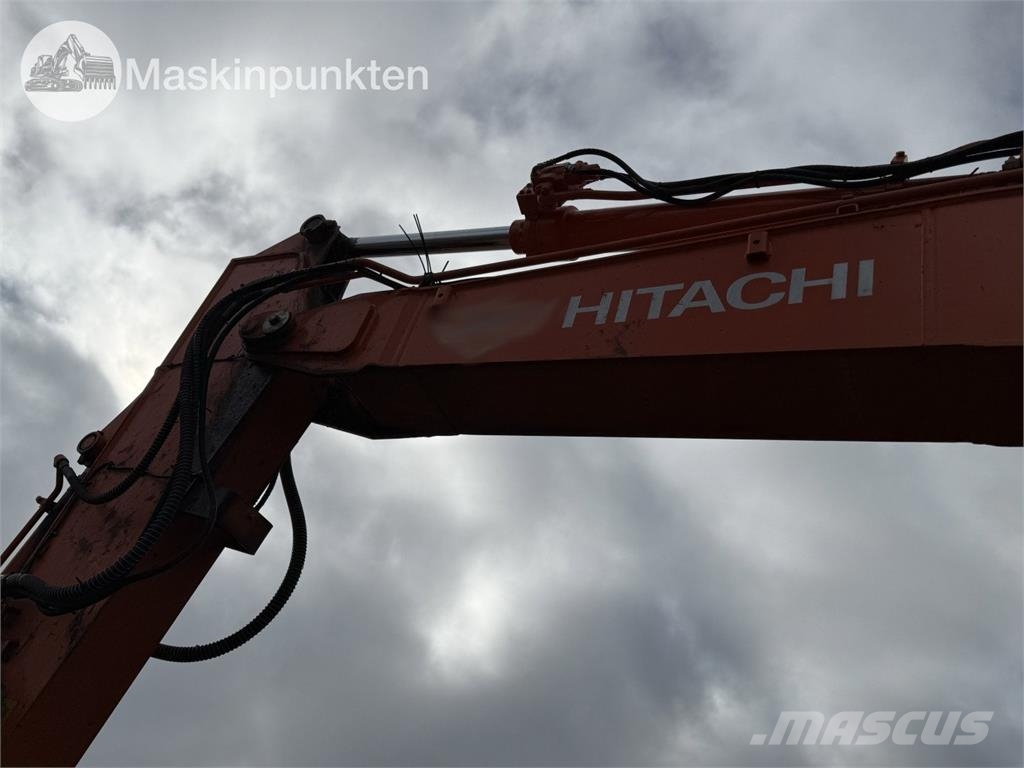 Hitachi ZX 140W-5B حفارات بعجل