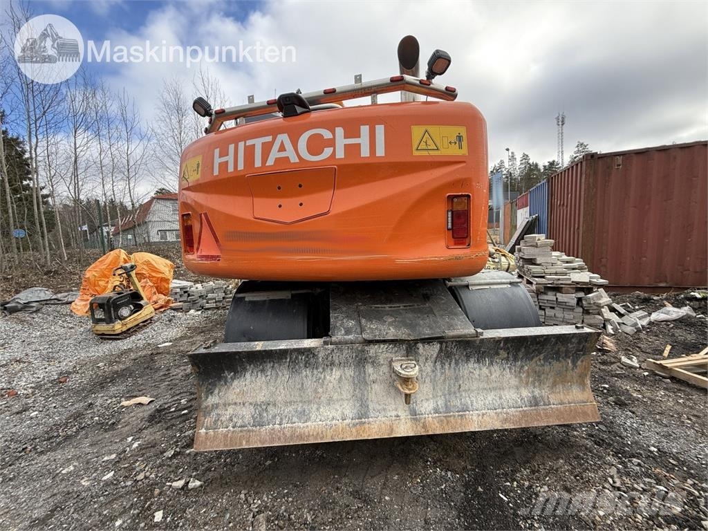 Hitachi ZX 140W-5B حفارات بعجل