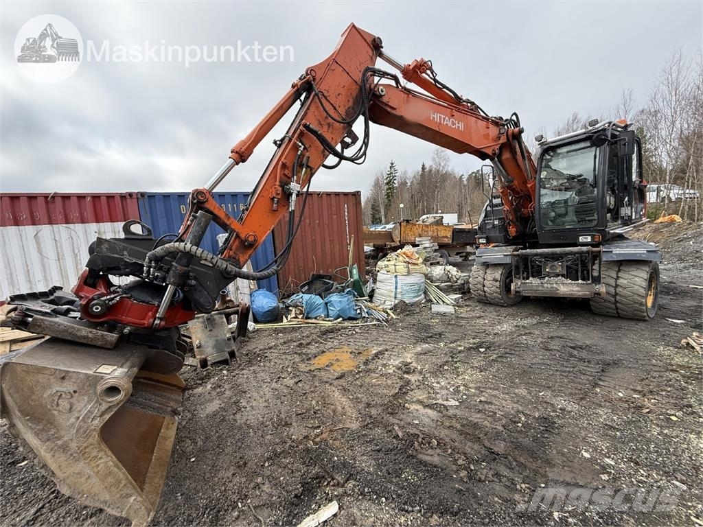 Hitachi ZX 140W-5B حفارات بعجل