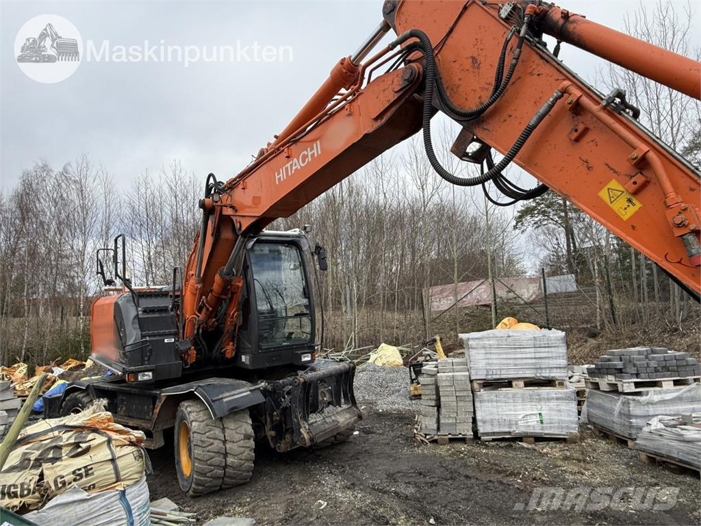 Hitachi ZX 140W-5B حفارات بعجل