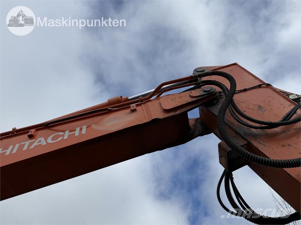 Hitachi ZX 140W-5B حفارات بعجل