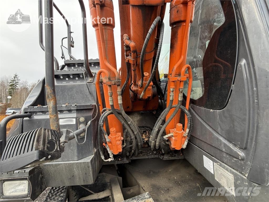 Hitachi ZX 140W-5B حفارات بعجل