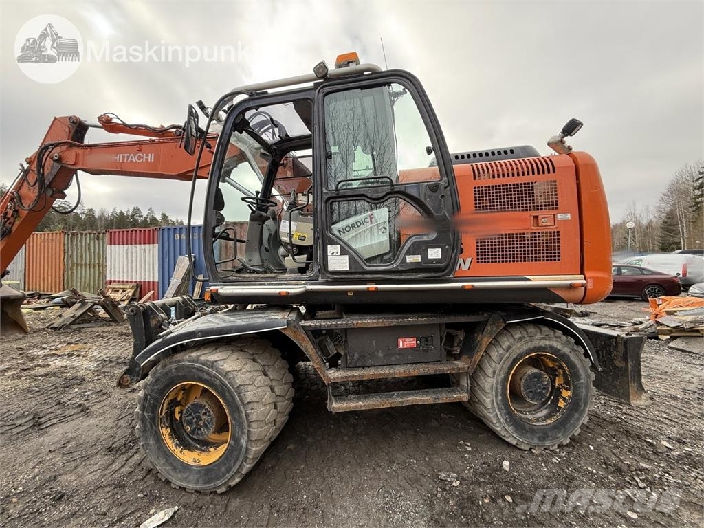 Hitachi ZX 140W-5B حفارات بعجل