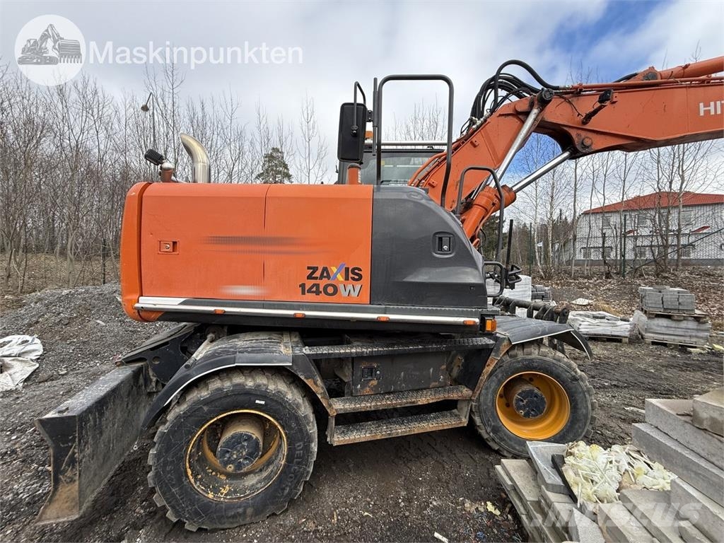 Hitachi ZX 140W-5B حفارات بعجل