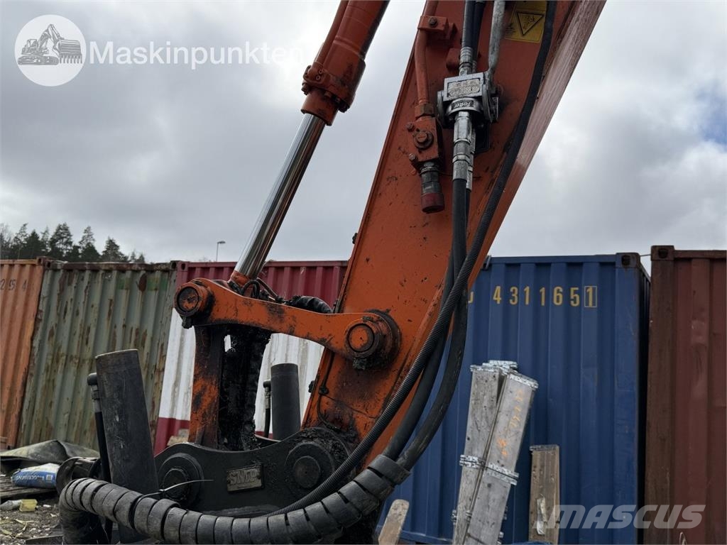 Hitachi ZX 140W-5B حفارات بعجل