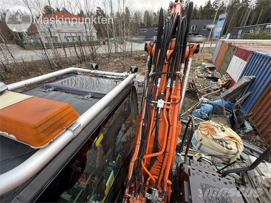 Hitachi ZX 140W-5B حفارات بعجل