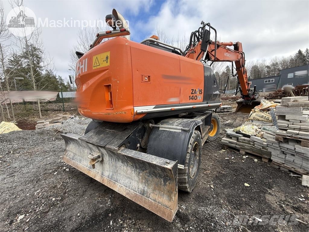 Hitachi ZX 140W-5B حفارات بعجل