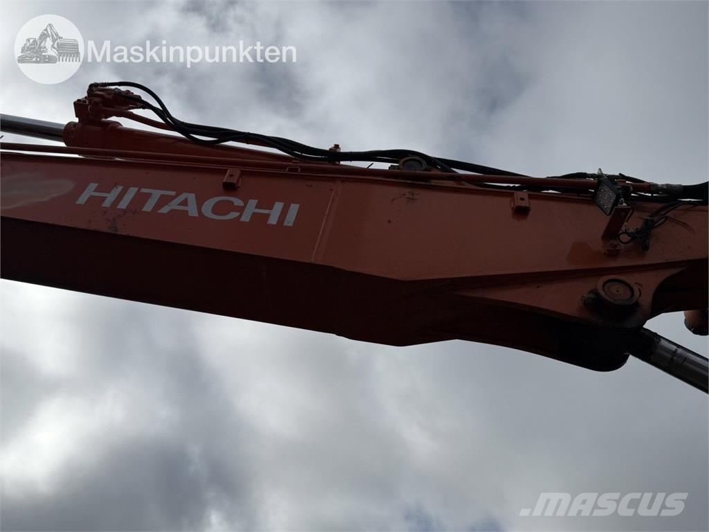 Hitachi ZX 140W-5B حفارات بعجل