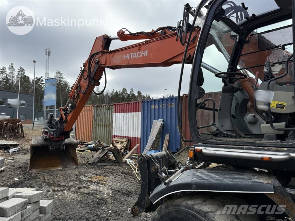 Hitachi ZX 140W-5B حفارات بعجل