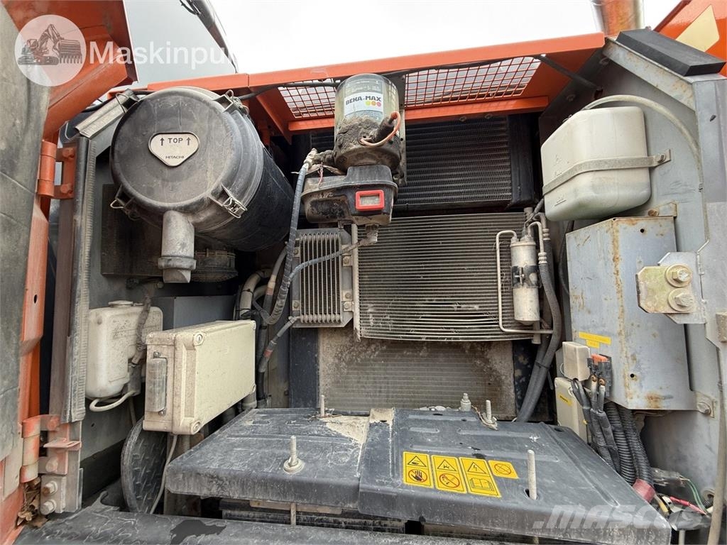 Hitachi ZX 140W-5B حفارات بعجل