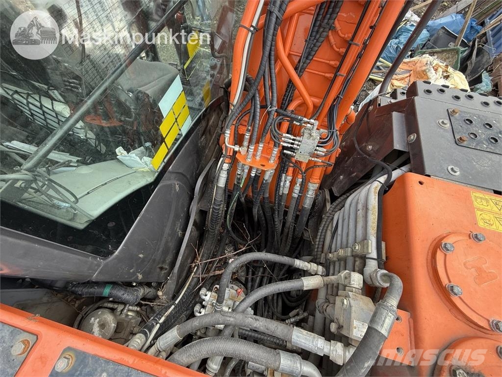 Hitachi ZX 140W-5B حفارات بعجل