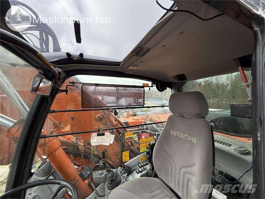 Hitachi ZX 140W-5B حفارات بعجل