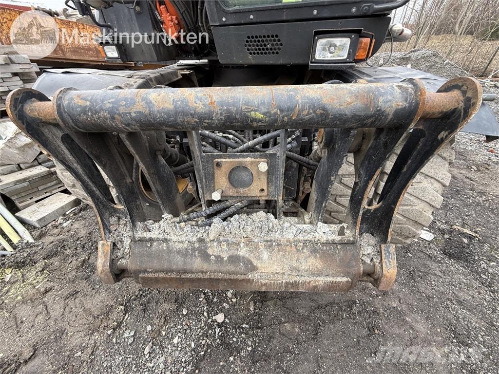 Hitachi ZX 140W-5B حفارات بعجل