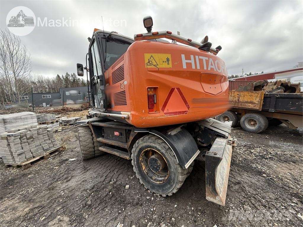 Hitachi ZX 140W-5B حفارات بعجل
