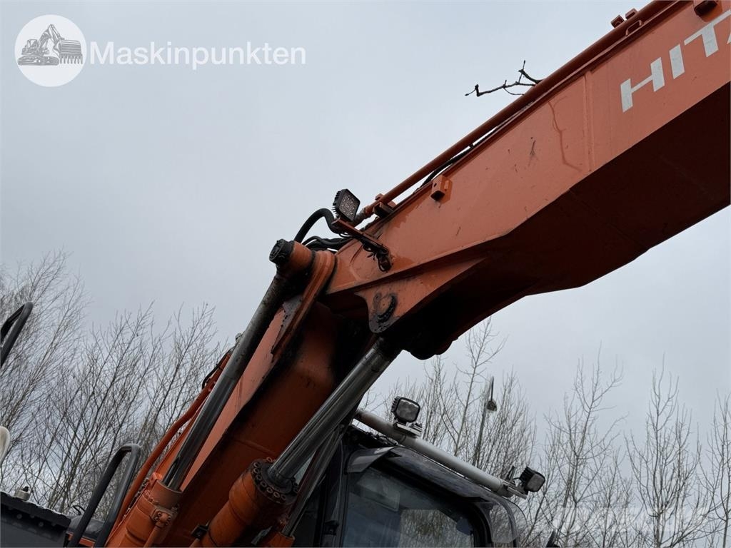 Hitachi ZX 140W-5B حفارات بعجل